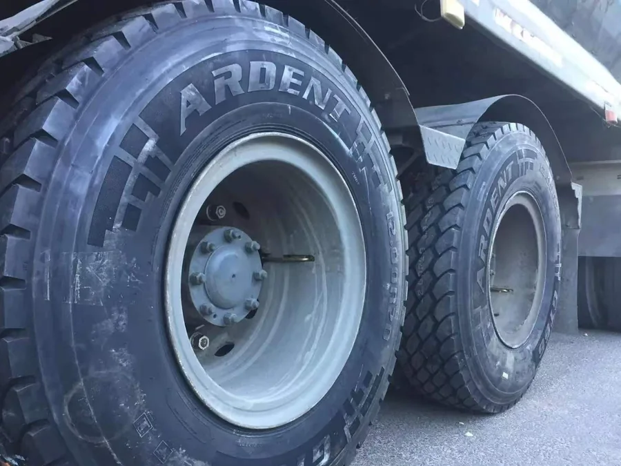 Close-up of drive-axle tyres and wheel hubs on a used truck