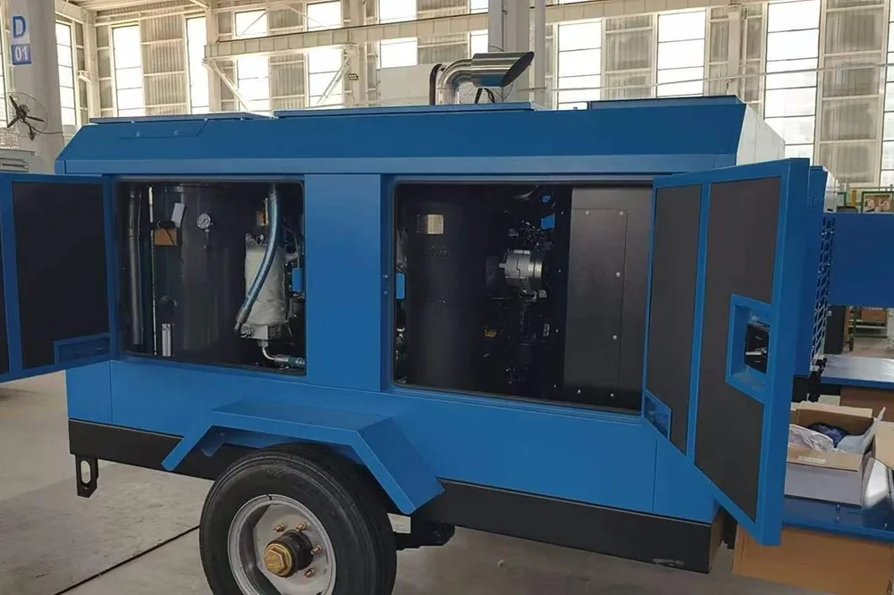 Towable screw air compressor with enclosure doors open