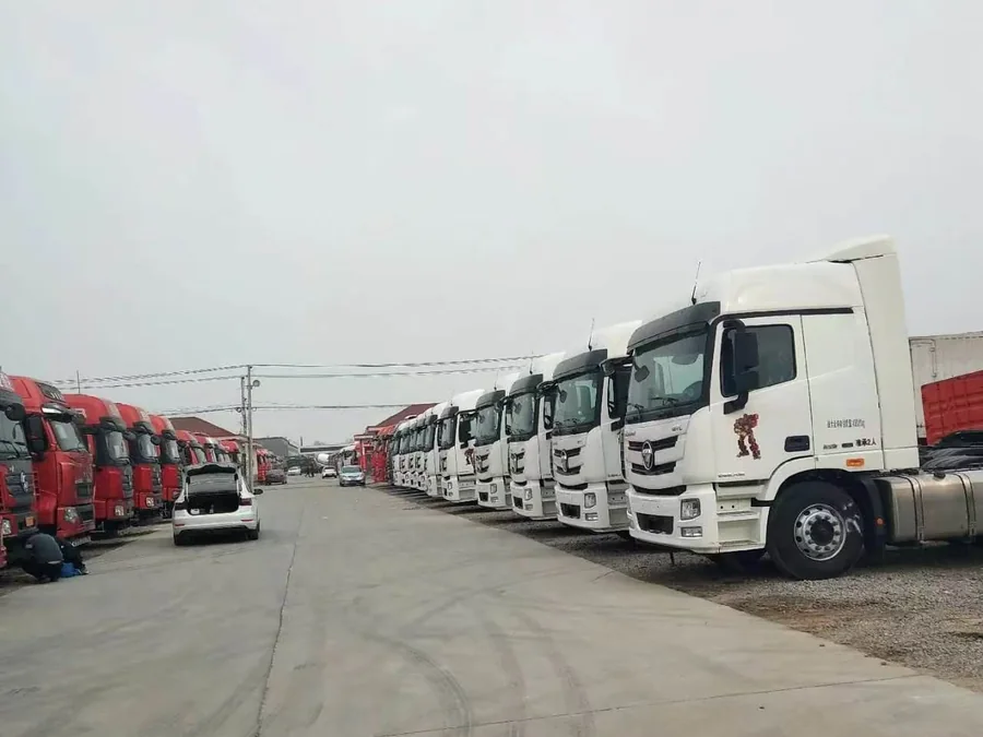 Row of used tractor heads parked at a yard in Liangshan, Shandong, China